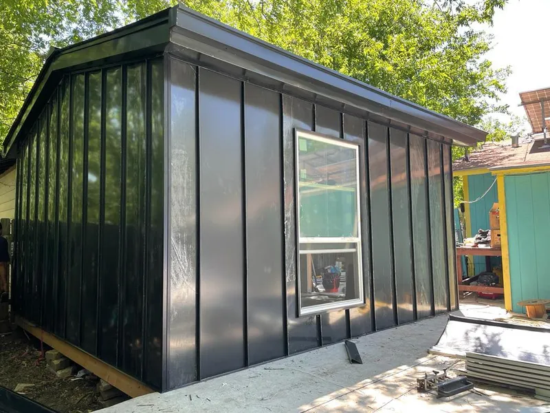 Black standing seam metal wall panels for Roof Inspection in Huntsville